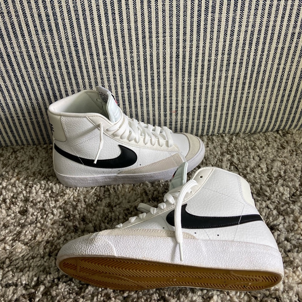 Nike White Hightop Sneakers with Black Logo
